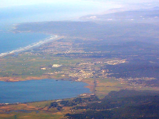 [Oblique aerial photo looking north at Arcata Bay, Arcata and McKinleyville]