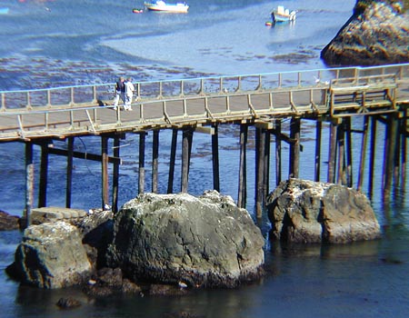 [Photo of couple strolling on Trinidad pier]